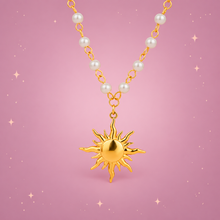 18K Gold-Plated Pearl Sun Necklace on a dusty rose background with rose gold sparkles