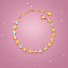 Blue Enamel Flower Bracelet on a dusty rose background with rose gold sparkles