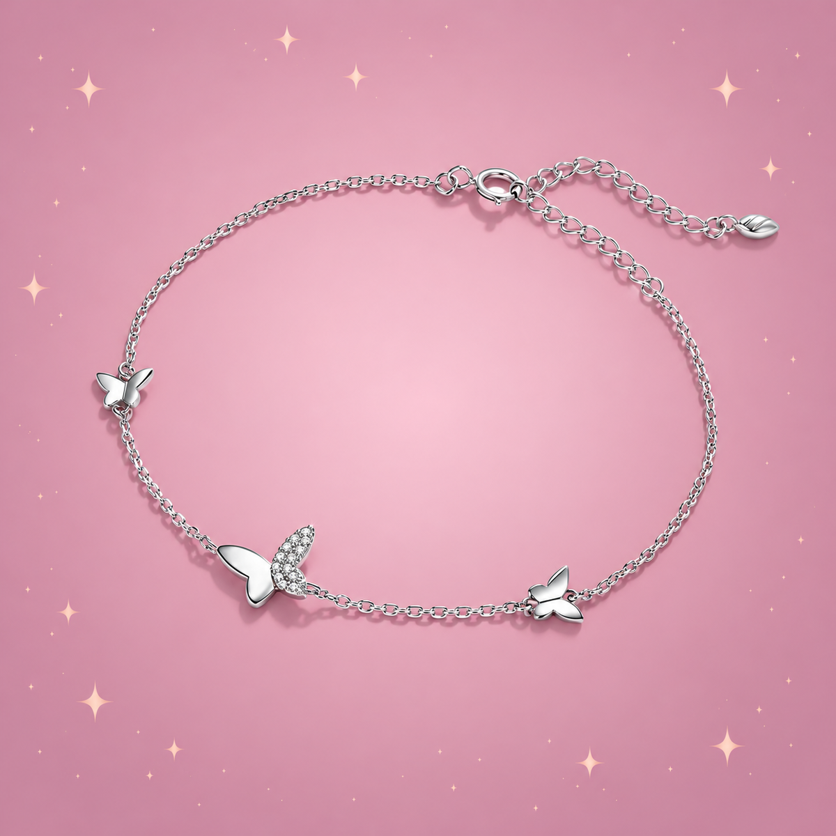 Butterfly Silver Bracelet on a dusty rose background with rose gold sparkles