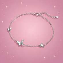 Butterfly Silver Bracelet on a dusty rose background with rose gold sparkles