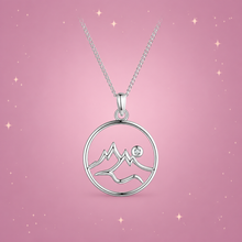 Dashan Silver Necklace on a dusty rose background with rose gold sparkles