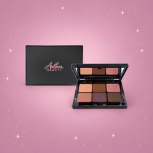Sweet Almond Eyeshadow Palette — complete product centered on a blush pink background with rose gold sparkles