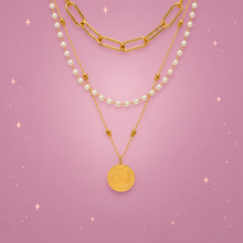 Faux Pearl Layered Necklace on a dusty rose background with rose gold sparkles