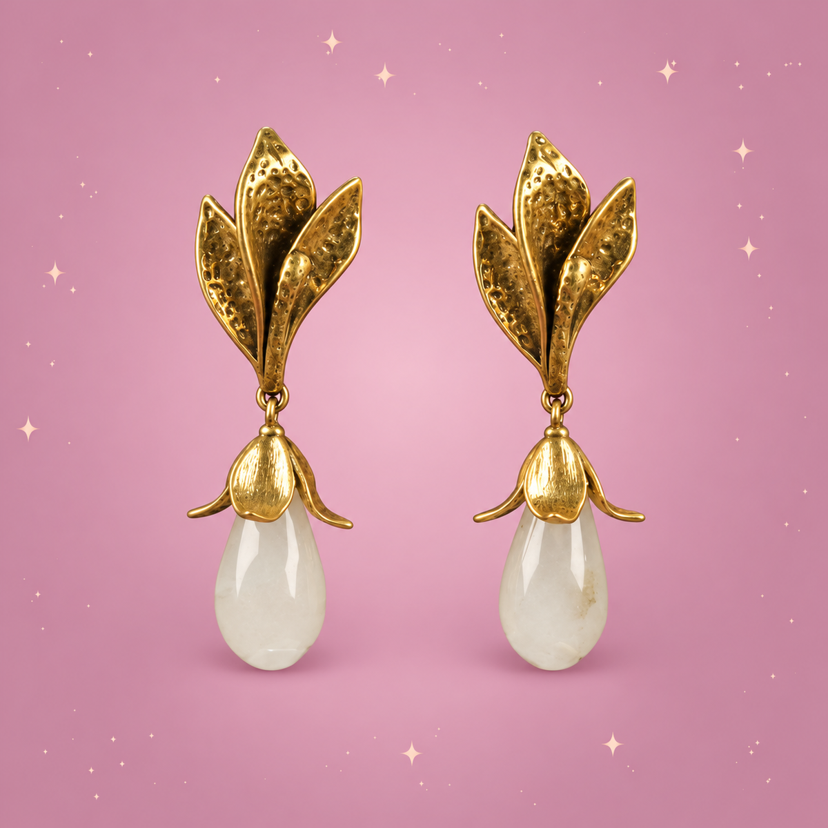 Flower Drop Earrings on a dusty rose background with rose gold sparkles