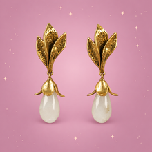 Flower Drop Earrings on a dusty rose background with rose gold sparkles