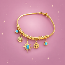 Gold-Plated Charm Bracelet on a dusty rose background with rose gold sparkles