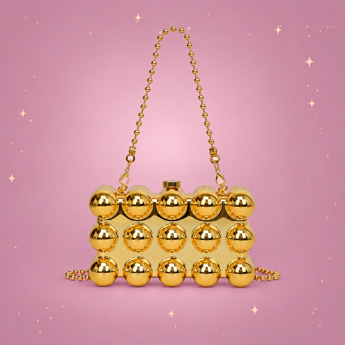 Pearl Chain Mini Lipstick Bag on a dusty rose background with rose gold sparkles