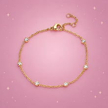 Sparkle Chain Bracelet on a dusty rose background with rose gold sparkles
