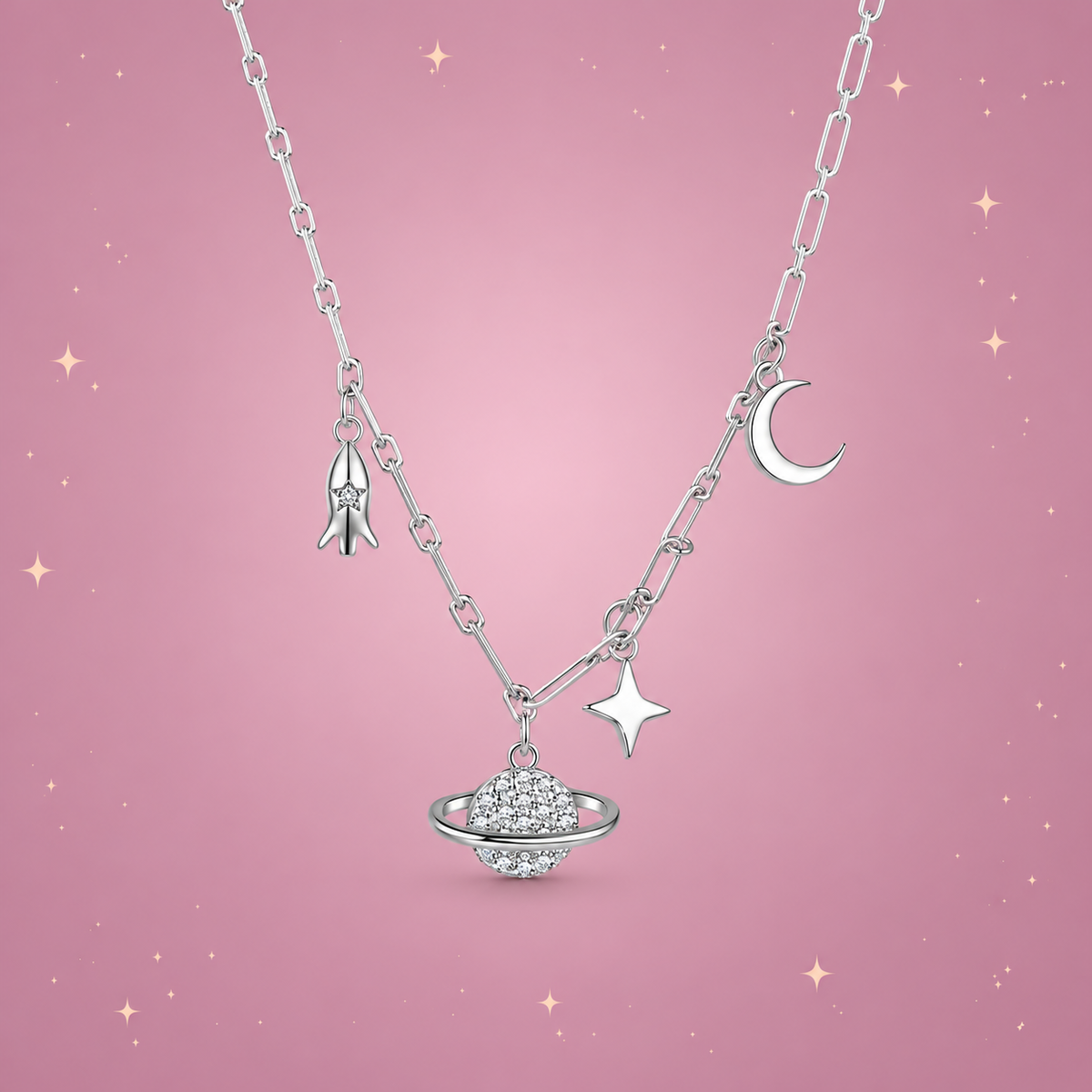 Starry Sky Silver Necklace on a dusty rose background with rose gold sparkles