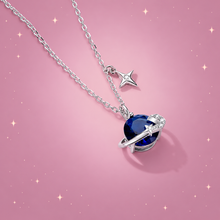 Starry Sky Silver Pendant Necklace on a dusty rose background with rose gold sparkles