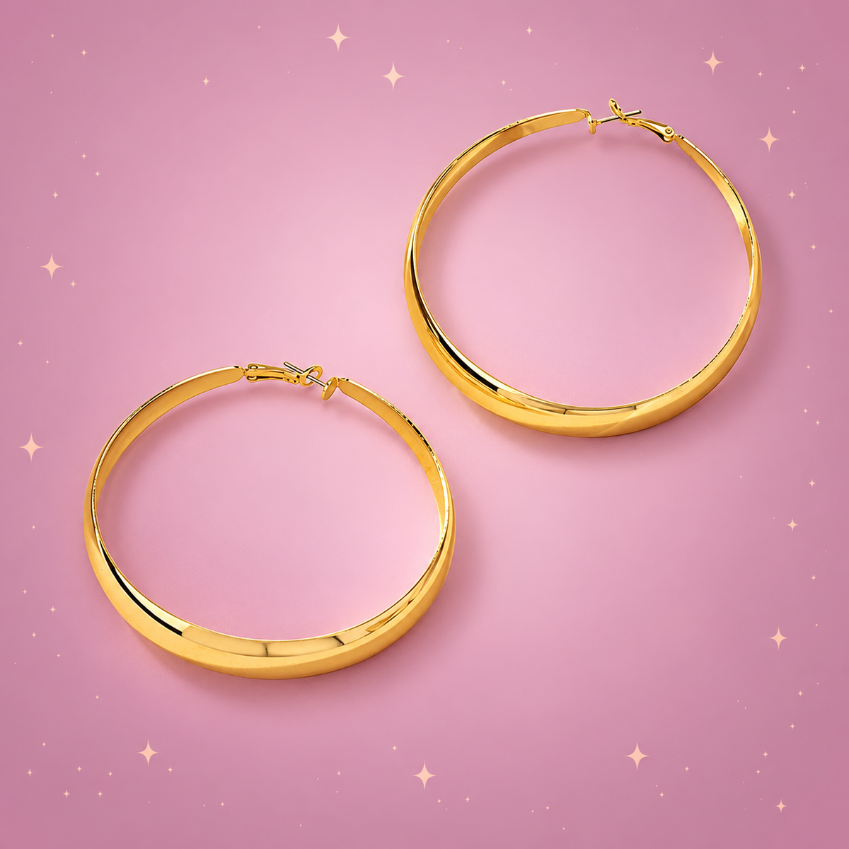Statement Hoop Earrings on a dusty rose background with rose gold sparkles