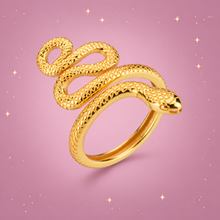 Sterling Silver Snake Ring on a dusty rose background with rose gold sparkles