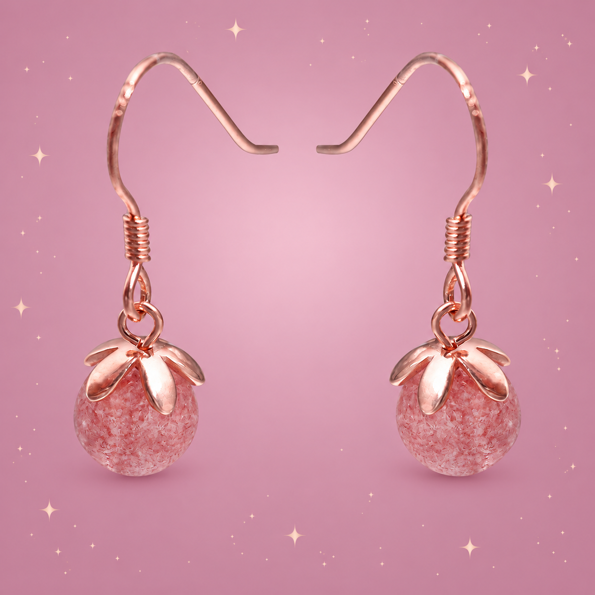Strawberry Crystal Earrings on a dusty rose background with rose gold sparkles