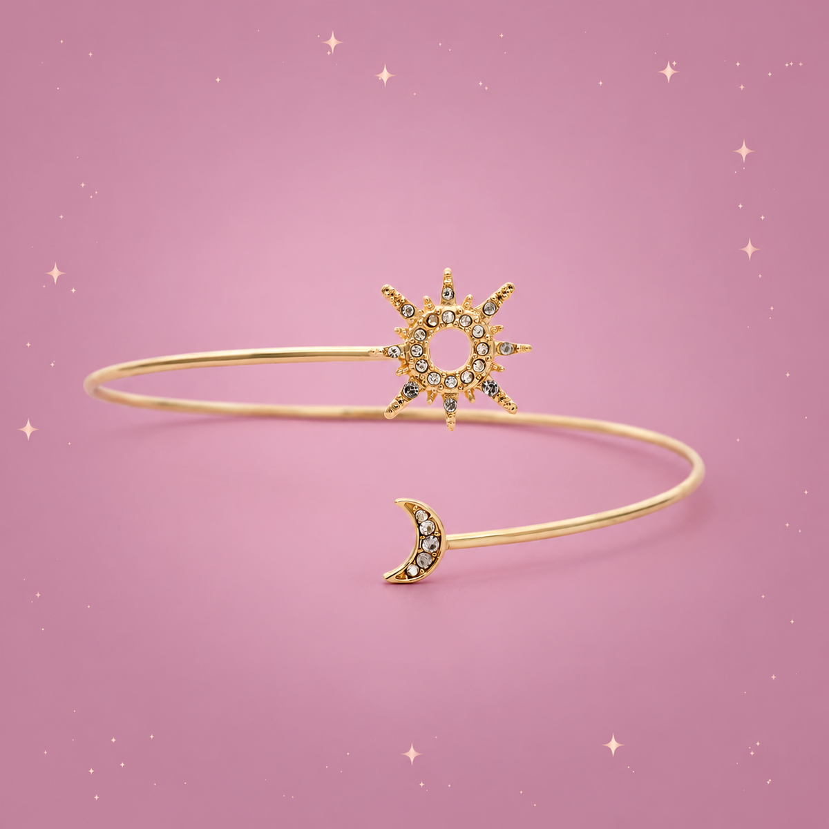 Sun & Moon Arm Cuff on a dusty rose background with rose gold sparkles