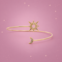 Sun & Moon Arm Cuff on a dusty rose background with rose gold sparkles