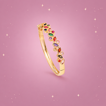 Zircon Leaf Bracelet on a dusty rose background with rose gold sparkles